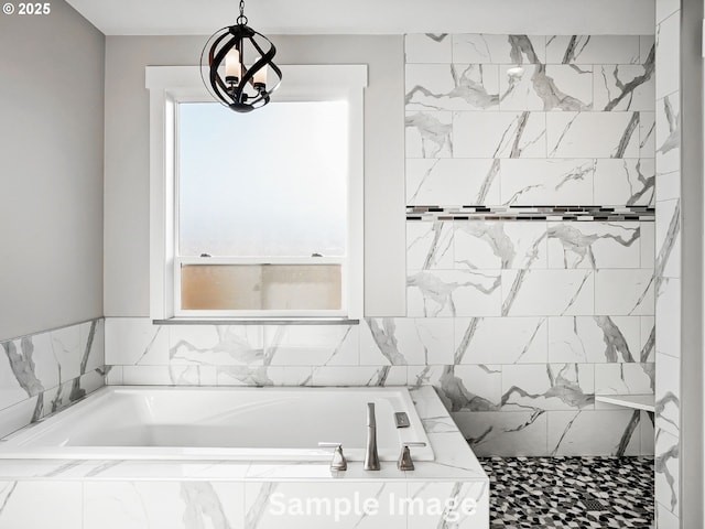 full bathroom featuring a garden tub, a notable chandelier, and tiled shower