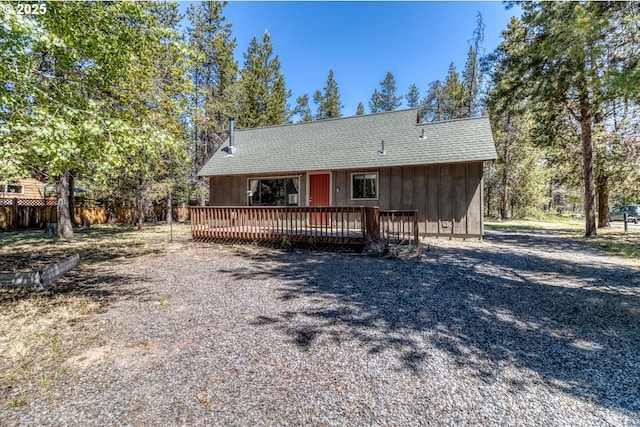 56095 Black Duck Rd, Bend, OR 97707 - view of front of home featuring a deck and roof with shingles