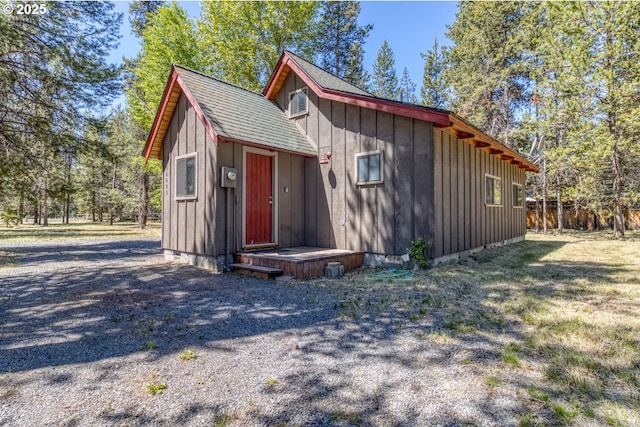 56095 Black Duck Rd, Bend, OR 97707 - view of front of property featuring board and batten siding and an outdoor structure