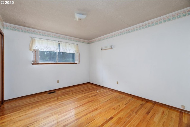 7450 SW Wilson Ave, Beaverton, OR 97008 - spare room featuring light wood-style flooring