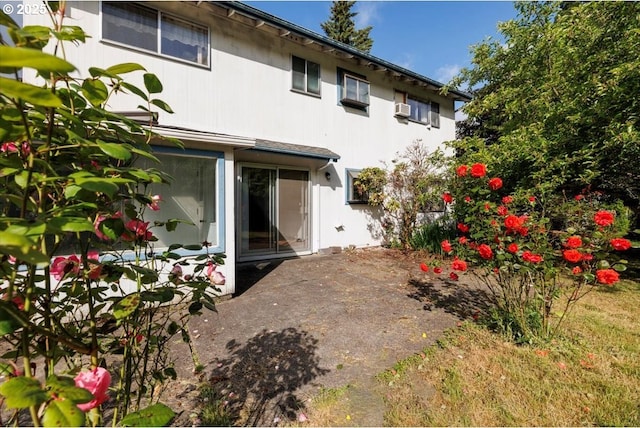 7450 SW Wilson Ave, Beaverton, OR 97008 - rear view of house with a wall mounted AC