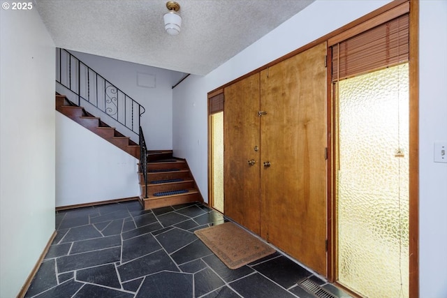 7450 SW Wilson Ave, Beaverton, OR 97008 - foyer entrance with stairway and a textured ceiling