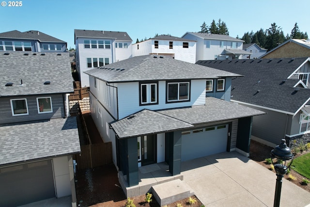 15129 SW Deepbrook Ln, Tigard, OR 97224 - view of front of property featuring roof with shingles, driveway, a garage, a residential view, and covered porch