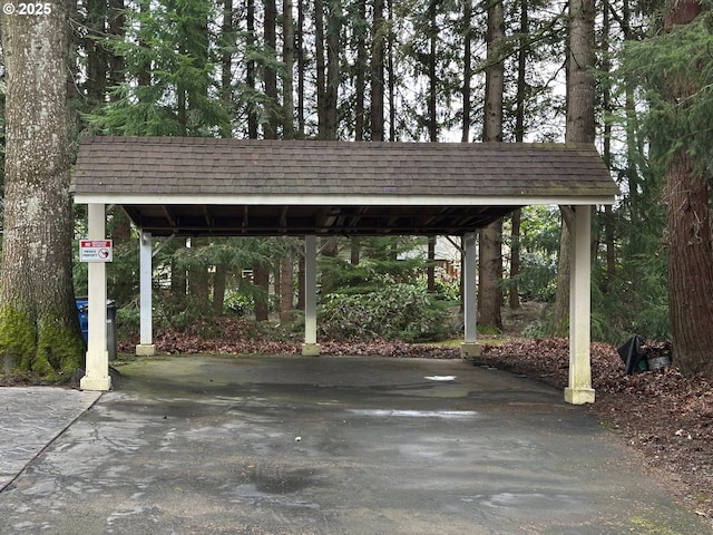 view of parking / parking lot featuring a carport