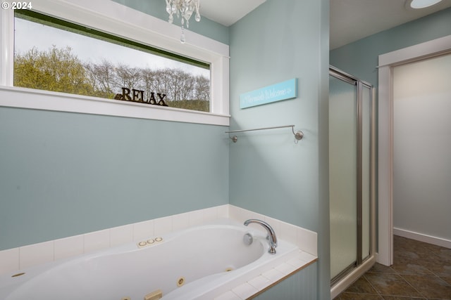 full bathroom with a shower stall, a tub with jets, and tile patterned floors