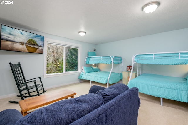 carpeted bedroom with baseboards