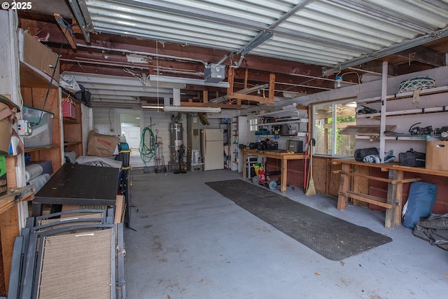 1540 Juniper St, Junction City, OR 97448 - garage with a workshop area, a garage door opener, and freestanding refrigerator