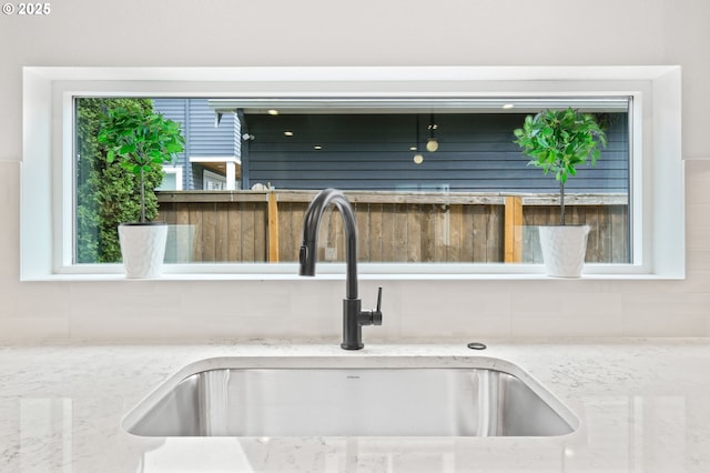 3528 NE 44th Ave, Portland, OR 97212 - detailed view of a sink, tasteful backsplash, and light stone countertops