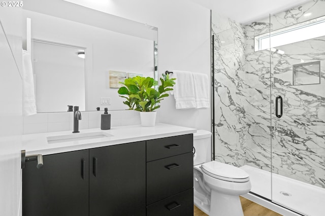 3528 NE 44th Ave, Portland, OR 97212 - bathroom featuring vanity, a marble finish shower, toilet, and wood finished floors