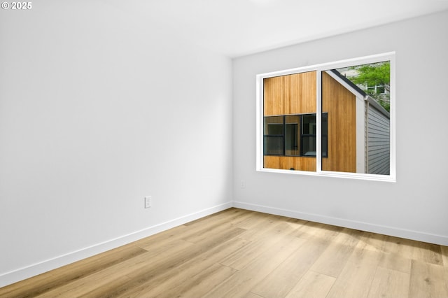 3528 NE 44th Ave, Portland, OR 97212 - empty room featuring light wood finished floors and baseboards