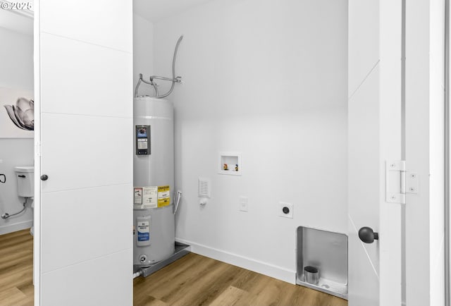 3528 NE 44th Ave, Portland, OR 97212 - washroom with electric water heater, hookup for an electric dryer, washer hookup, light wood-style flooring, and baseboards