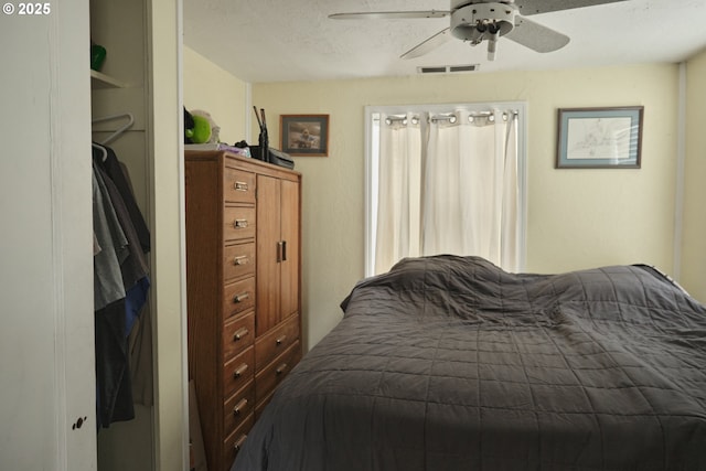 bedroom featuring visible vents and a ceiling fan