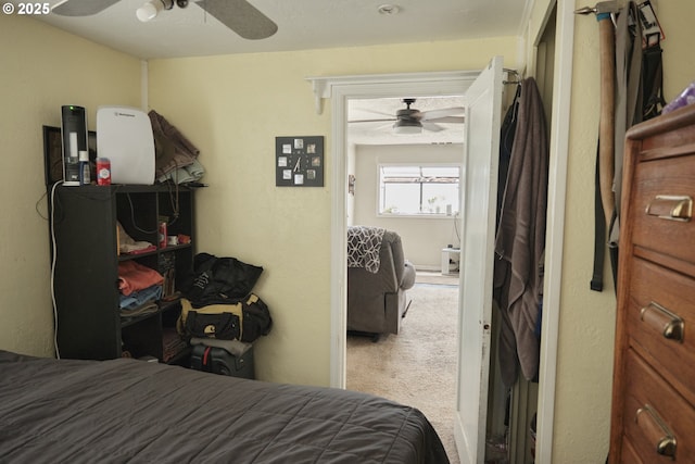 carpeted bedroom featuring ceiling fan