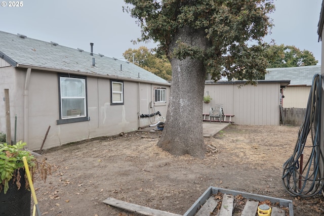 view of yard featuring a garden, a patio, and fence