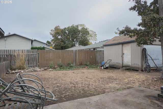 view of yard featuring an outbuilding and a fenced backyard