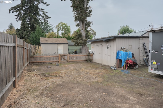 view of yard with an outdoor structure and a fenced backyard