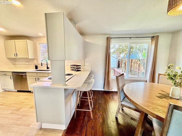 12708 NE 46th St, Vancouver, WA 98662 - kitchen with stainless steel dishwasher, stovetop, light wood-style flooring, light countertops, and recessed lighting