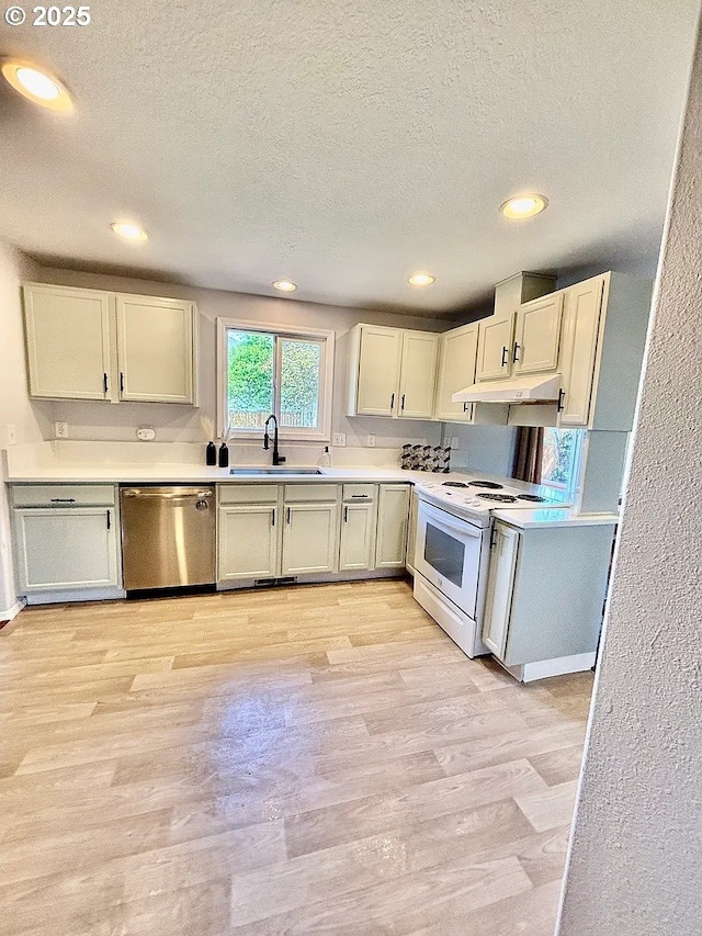 12708 NE 46th St, Vancouver, WA 98662 - kitchen with dishwasher, electric range, under cabinet range hood, a textured ceiling, and light countertops