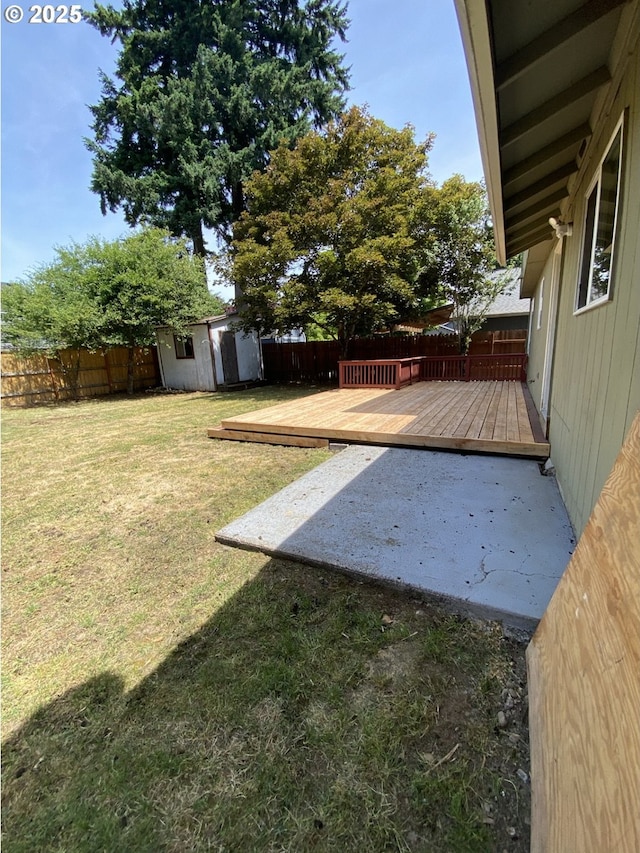 12708 NE 46th St, Vancouver, WA 98662 - fenced backyard with a wooden deck, a storage shed, and a patio