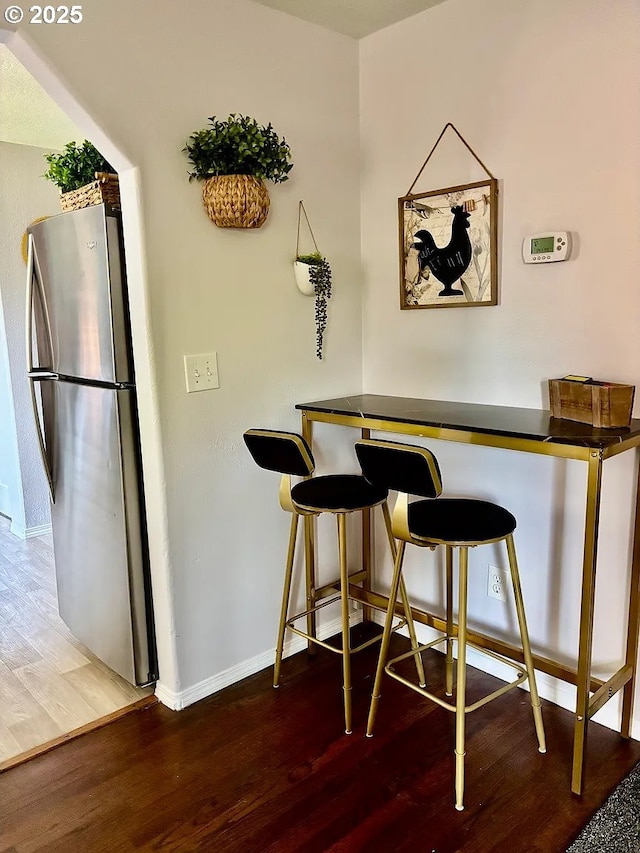 12708 NE 46th St, Vancouver, WA 98662 - bar with freestanding refrigerator and wood finished floors