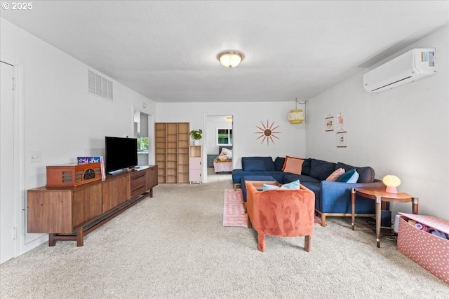 living area featuring an AC wall unit, visible vents, and light carpet