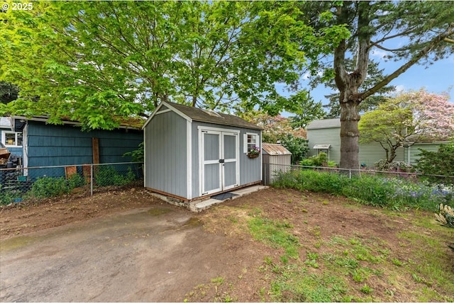 view of shed featuring a fenced backyard