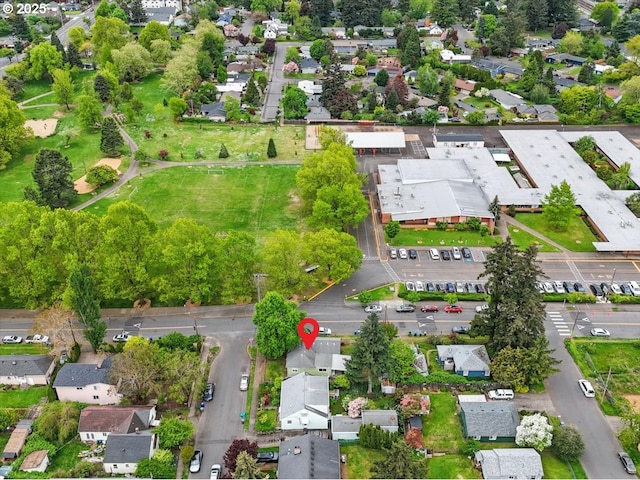 birds eye view of property with a residential view