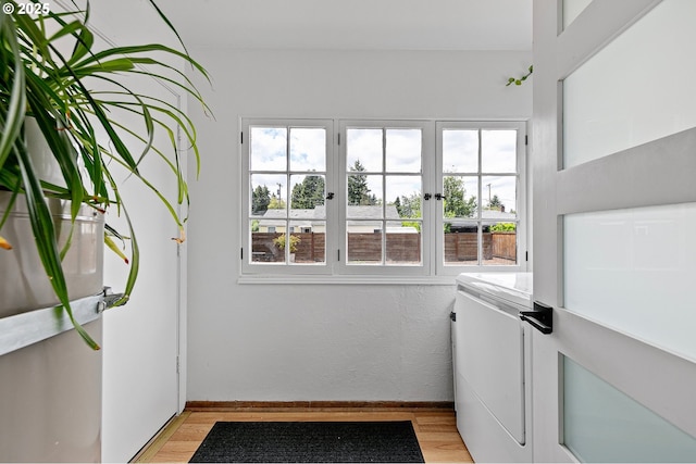 1090 Maple Dr, Eugene, OR 97404 - laundry area featuring light wood-style flooring, washer / clothes dryer, and baseboards