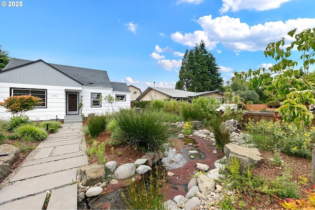 1090 Maple Dr, Eugene, OR 97404 - view of front facade with roof with shingles and board and batten siding