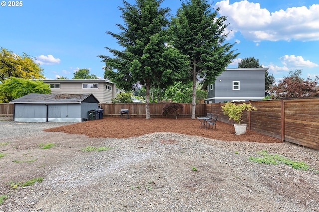 1090 Maple Dr, Eugene, OR 97404 - fenced backyard featuring an outbuilding