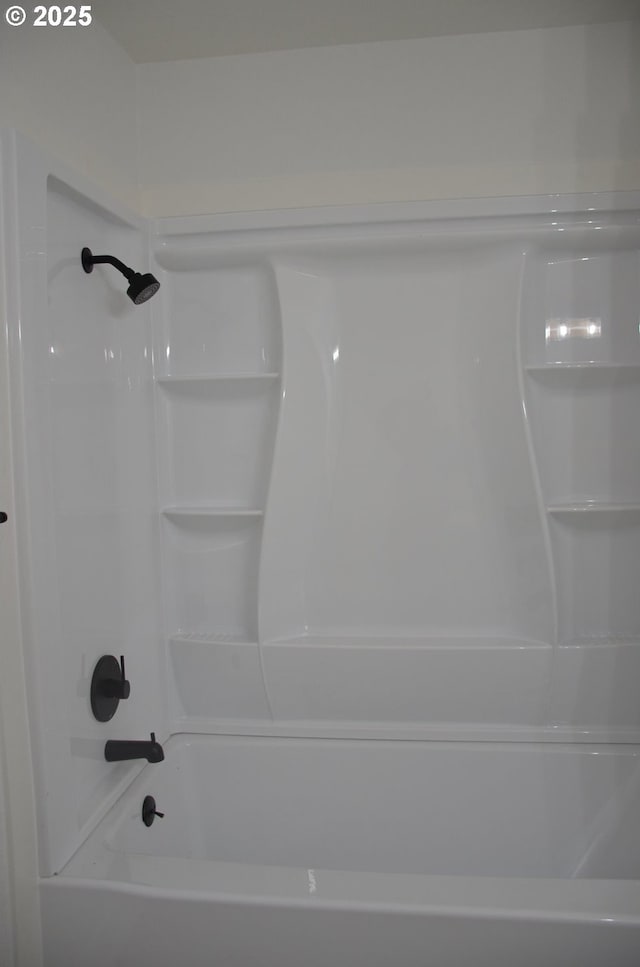 bathroom with shower / tub combination