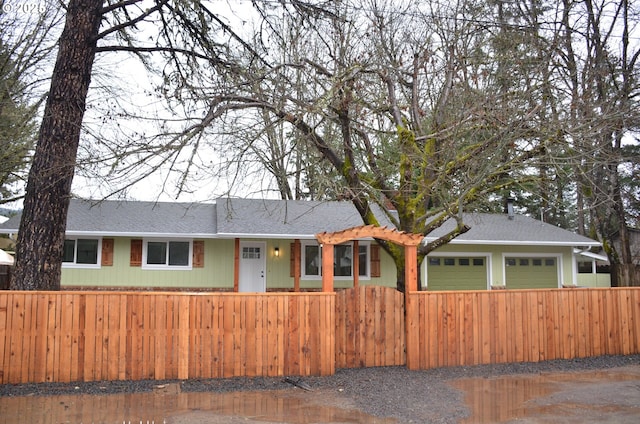 ranch-style home featuring a garage