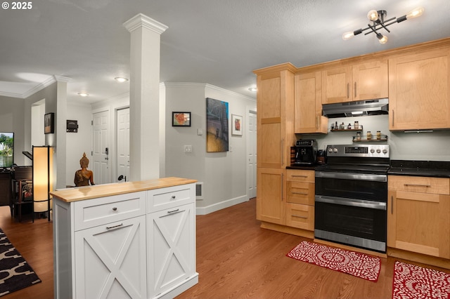 kitchen with ornate columns, double oven range, light brown cabinetry, and wood counters