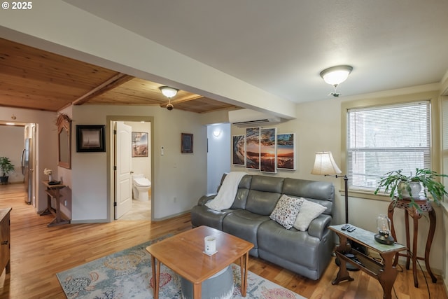 23830 Old Peak Rd, Philomath, OR 97370 - living room with wooden ceiling, light wood-style flooring, a wall mounted air conditioner, beamed ceiling, and baseboards