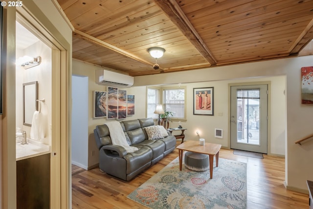 23830 Old Peak Rd, Philomath, OR 97370 - living area with wood ceiling, healthy amount of natural light, light wood-style flooring, and a wall unit AC