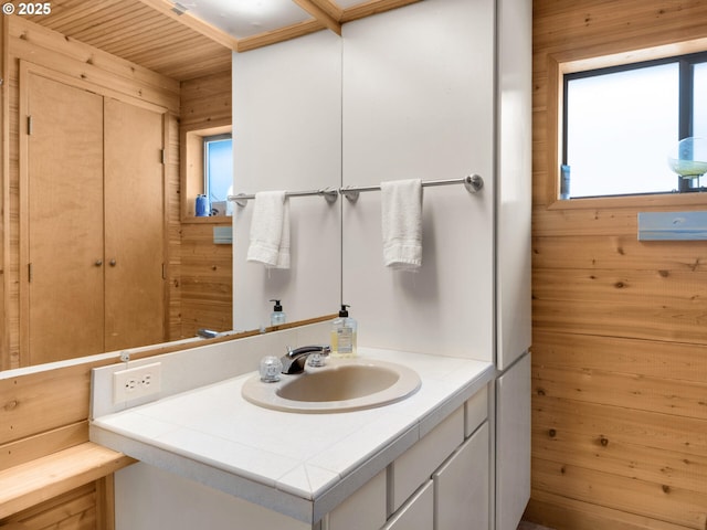 485 N Ave, Manzanita, OR 97130 - bathroom featuring wooden walls and vanity