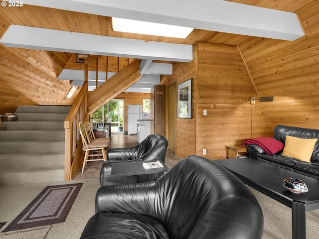 485 N Ave, Manzanita, OR 97130 - carpeted living room featuring wooden walls, stairs, and a wood ceiling with exposed beams