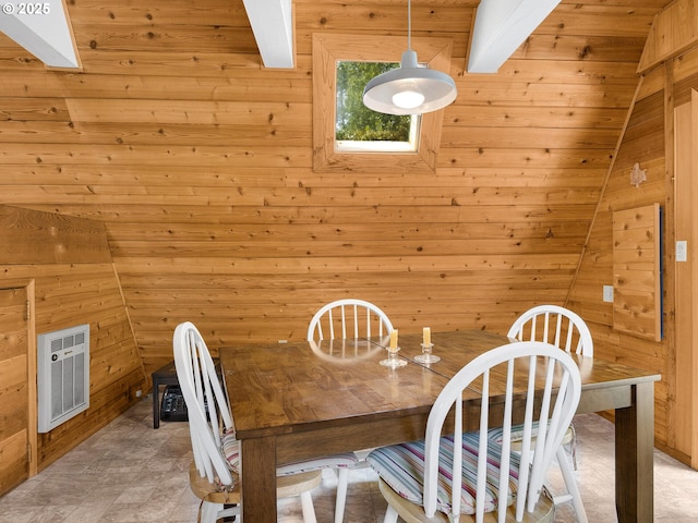 485 N Ave, Manzanita, OR 97130 - dining room featuring wooden walls, heating unit, and beamed ceiling