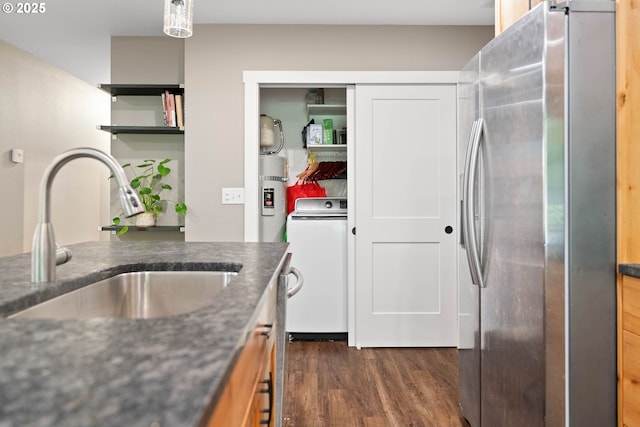 4607 SE 88th Ave, Portland, OR 97266 - kitchen featuring stainless steel fridge with ice dispenser, a sink, washer / clothes dryer, dark wood-type flooring, and secured water heater