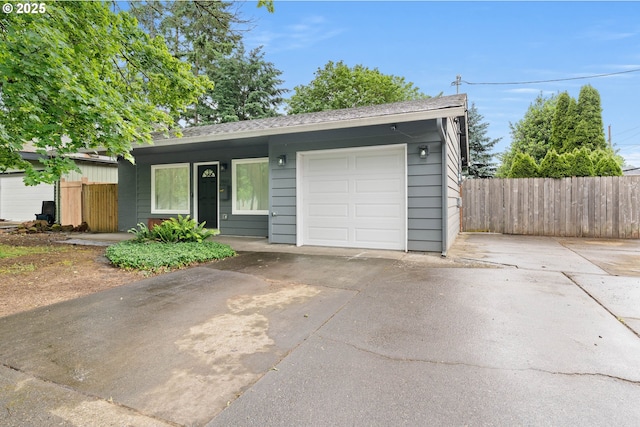 4607 SE 88th Ave, Portland, OR 97266 - view of front facade featuring concrete driveway, roof with shingles, and an attached garage