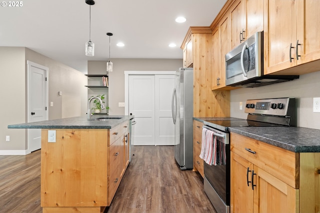 4607 SE 88th Ave, Portland, OR 97266 - kitchen with appliances with stainless steel finishes, a sink, dark countertops, dark wood-style flooring, and recessed lighting