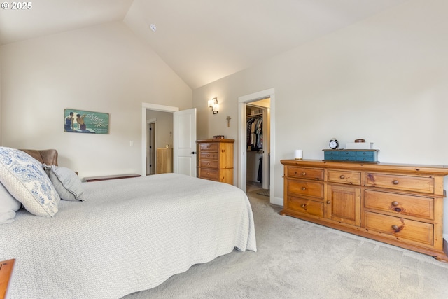 16033 SW 2nd St, Sherwood, OR 97140 - bedroom with a walk in closet, light colored carpet, a closet, and high vaulted ceiling