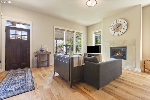 16033 SW 2nd St, Sherwood, OR 97140 - living room with light wood finished floors, a fireplace, and baseboards