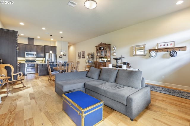 16033 SW 2nd St, Sherwood, OR 97140 - living room with light wood finished floors and recessed lighting