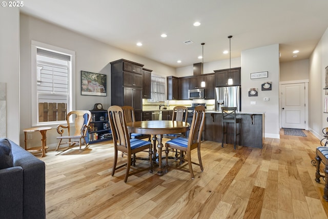 16033 SW 2nd St, Sherwood, OR 97140 - dining room with light wood finished floors, recessed lighting, and baseboards