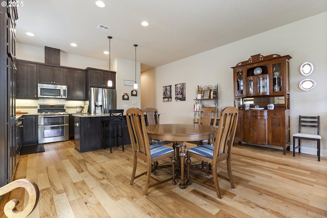 16033 SW 2nd St, Sherwood, OR 97140 - dining space with light wood-style flooring and recessed lighting