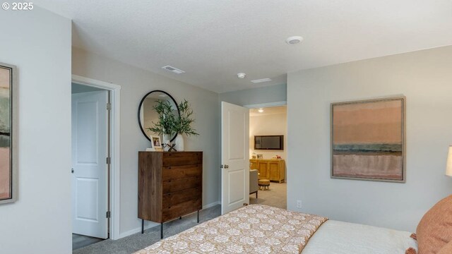 bedroom with light colored carpet