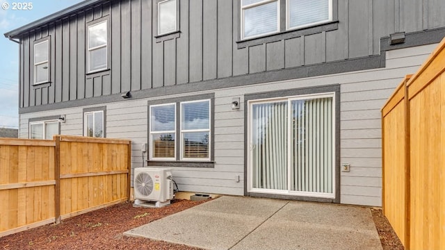 back of house with a patio area and ac unit