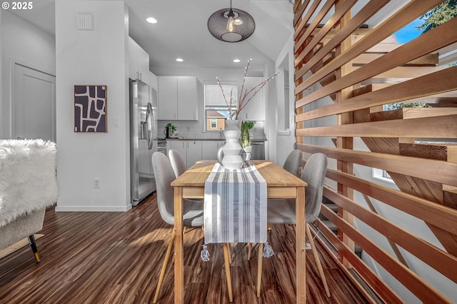 dining area featuring dark hardwood / wood-style flooring