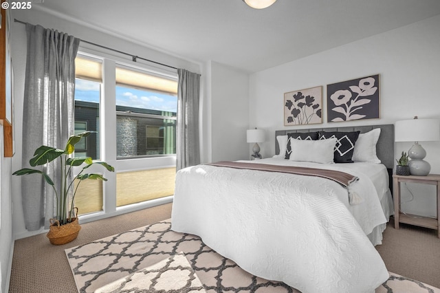 bedroom featuring light colored carpet